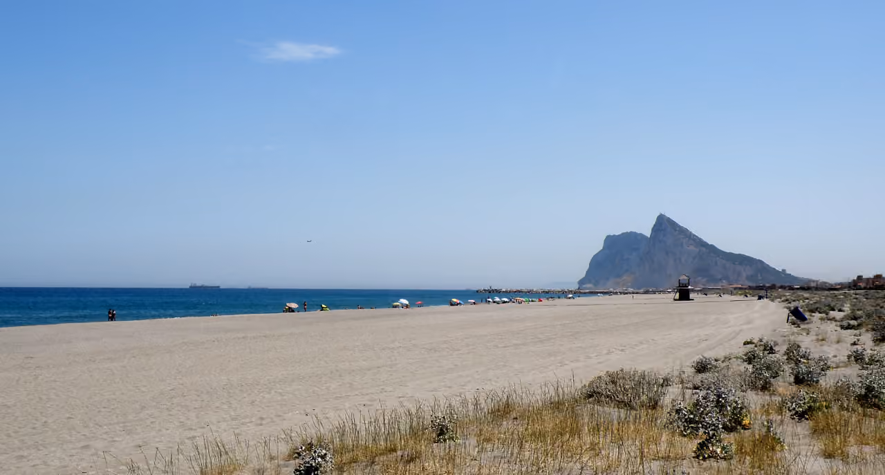 ATRIA - PHASE 1 area photograph of Playa de Sobrevela sandy beach with the Rock of Gibraltar in the background, La Línea de la Concepción, Costa del Sol