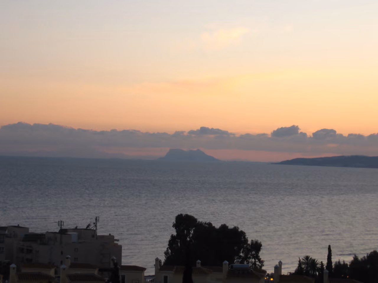 MARALTO area photograph showing a sunset seascape viewed from Estepona looking east towards the Rock of Gibraltar across the Mediterranean Sea