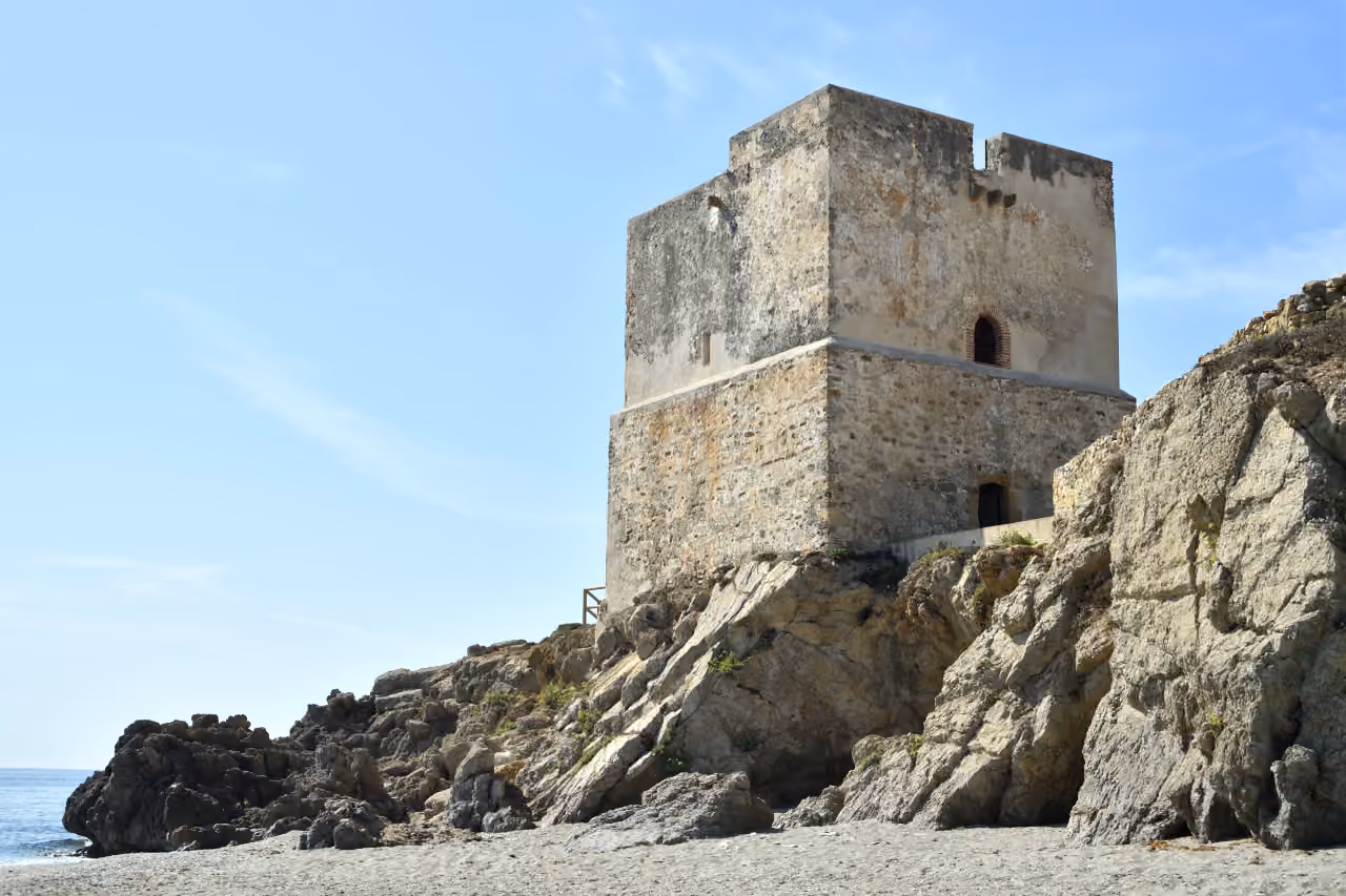 ARRECIFE area photograph of Torre de la Sal (Salto de la Mora), a 16th-century coastal watchtower on the Casares shoreline in Málaga province
